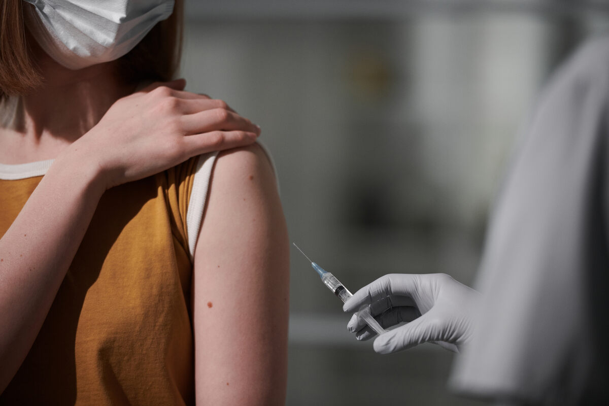 woman getting hepatitis b vaccine into arm